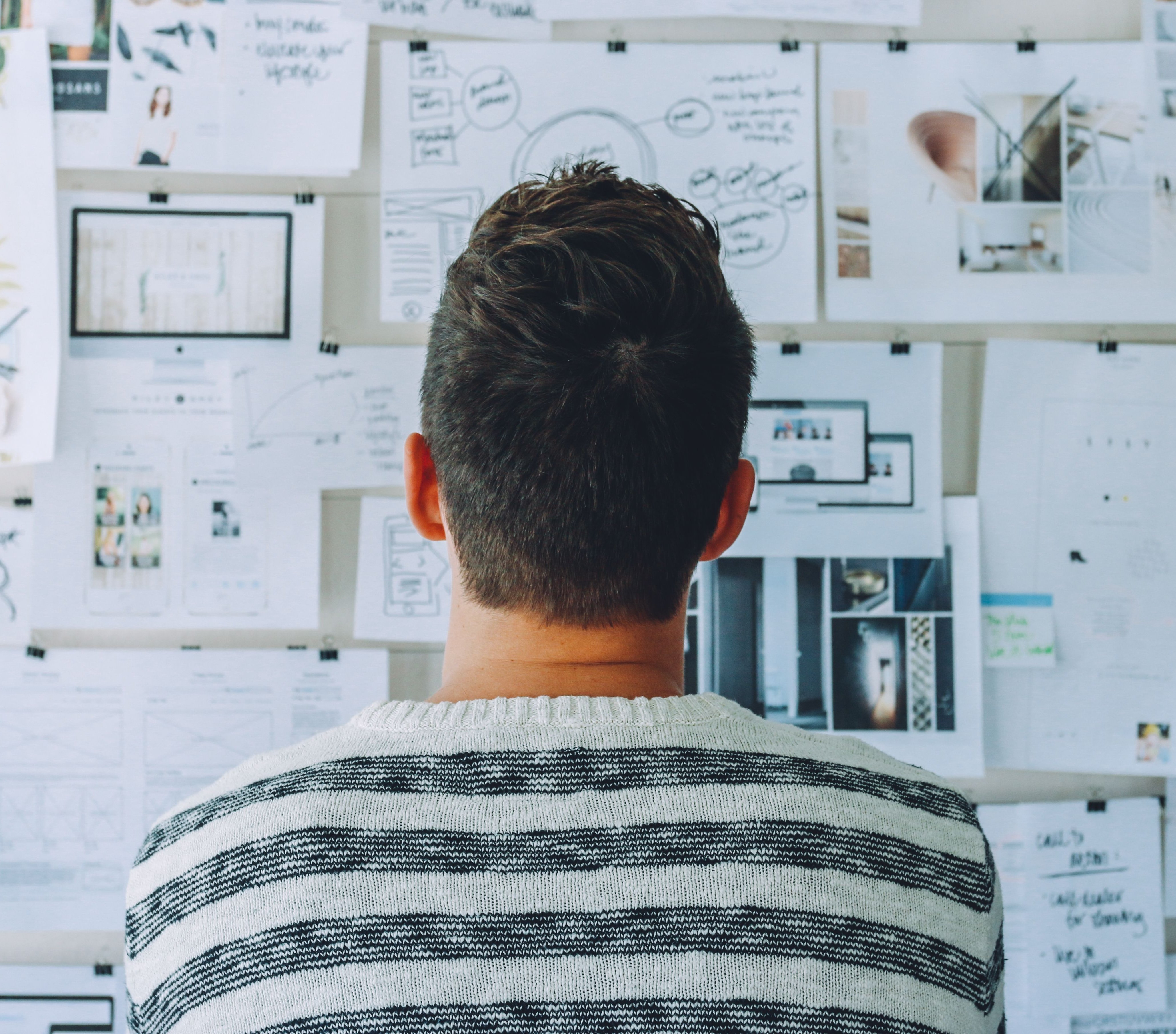 Startup Photos - Man looking at plans
