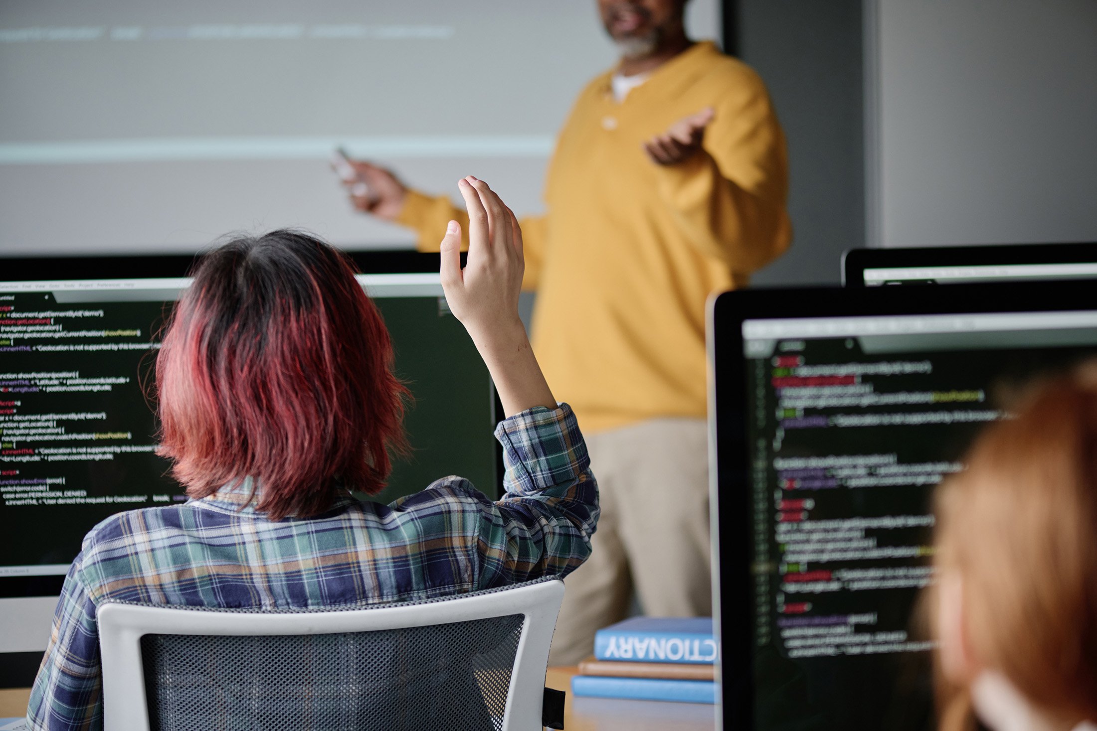 unrecognizable-girl-raising-hand-during-lesson-2025-02-10-09-49-44-utc-Smaller-1